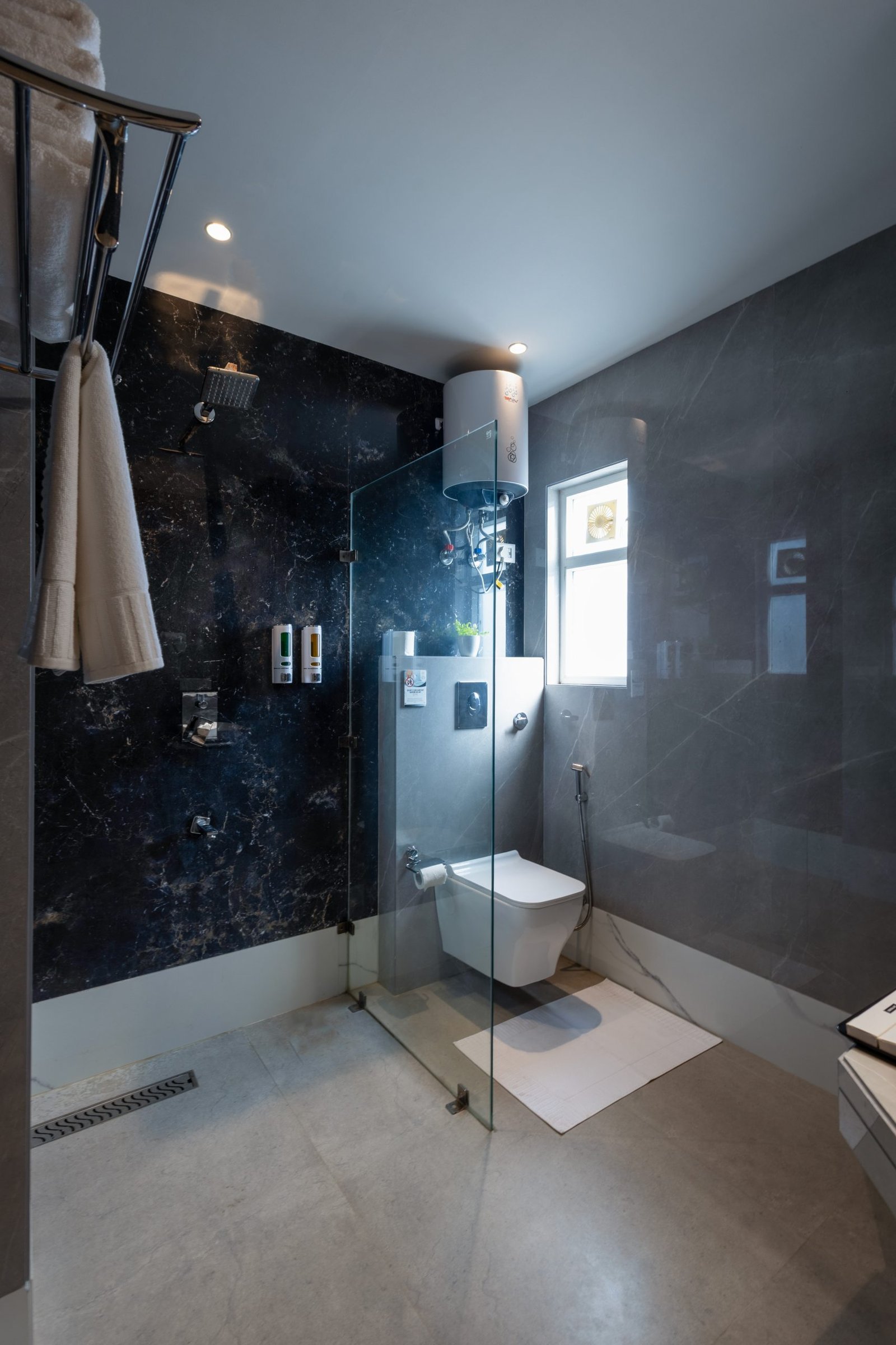 Clean tiled bathroom at Dahabi Era Aerocity