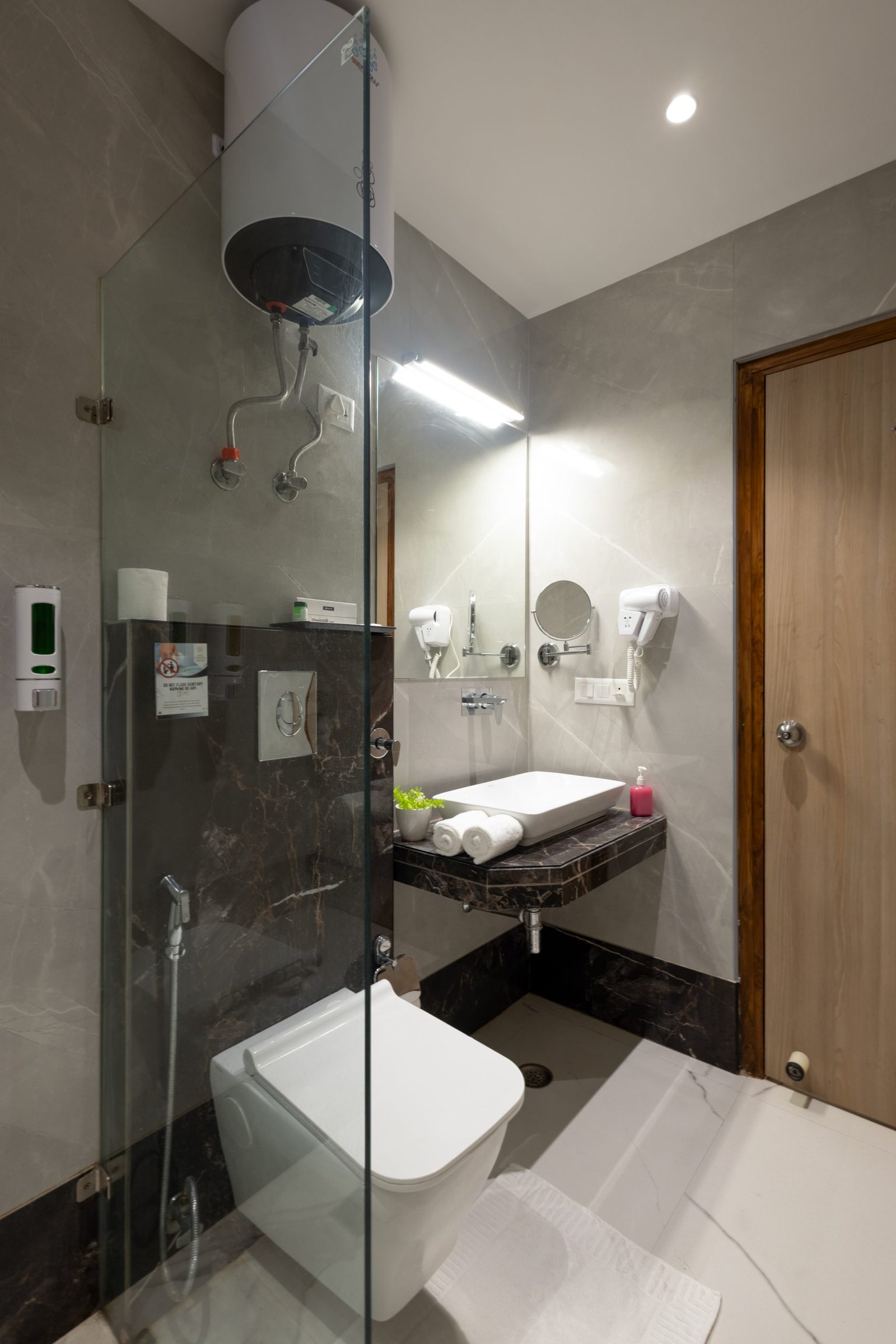 Modern ensuite bathroom at Dahabi Era Delhi Airport hotel