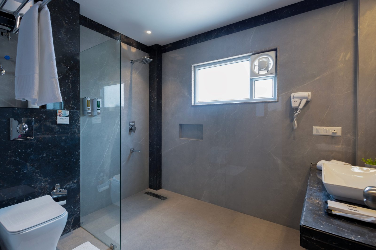 Walk-in shower in a Dahabi Era guest bathroom